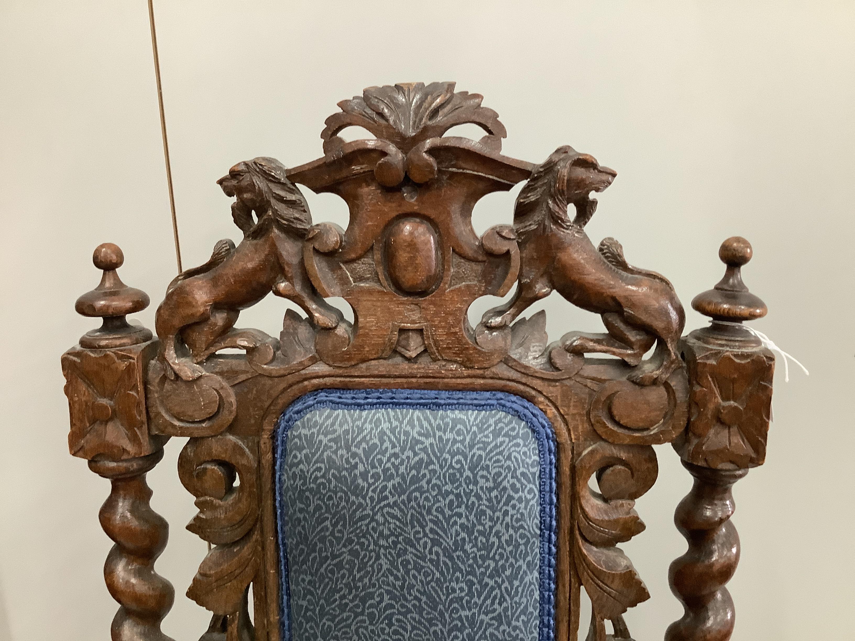 A Victorian Carolean style carved oak dining chair, height 112cm